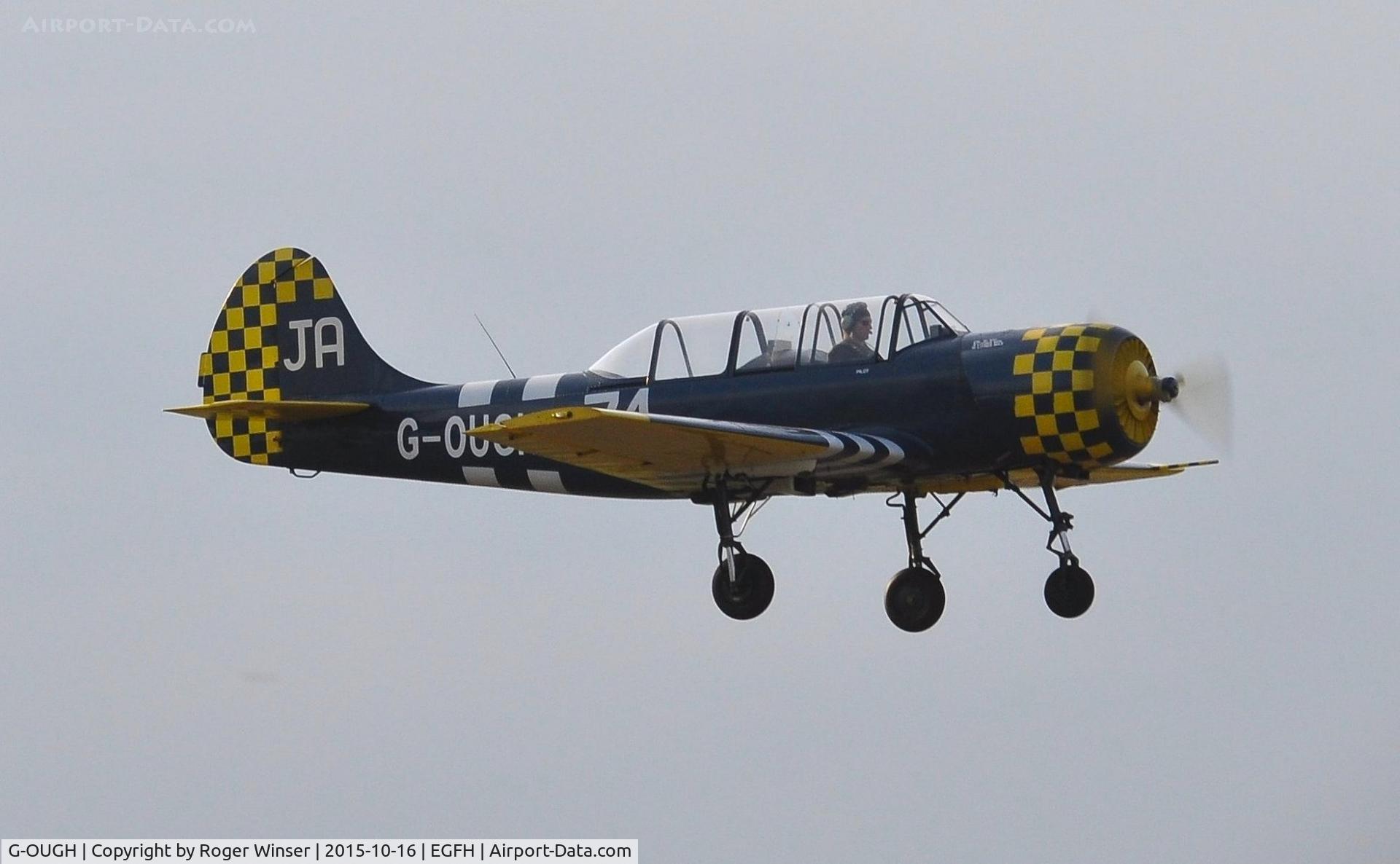 G-OUGH, 1987 Bacau Yak-52 C/N 877404, Resident Yak-52 departing Runway 04 for a local flight. Coded 62/IV on port side.