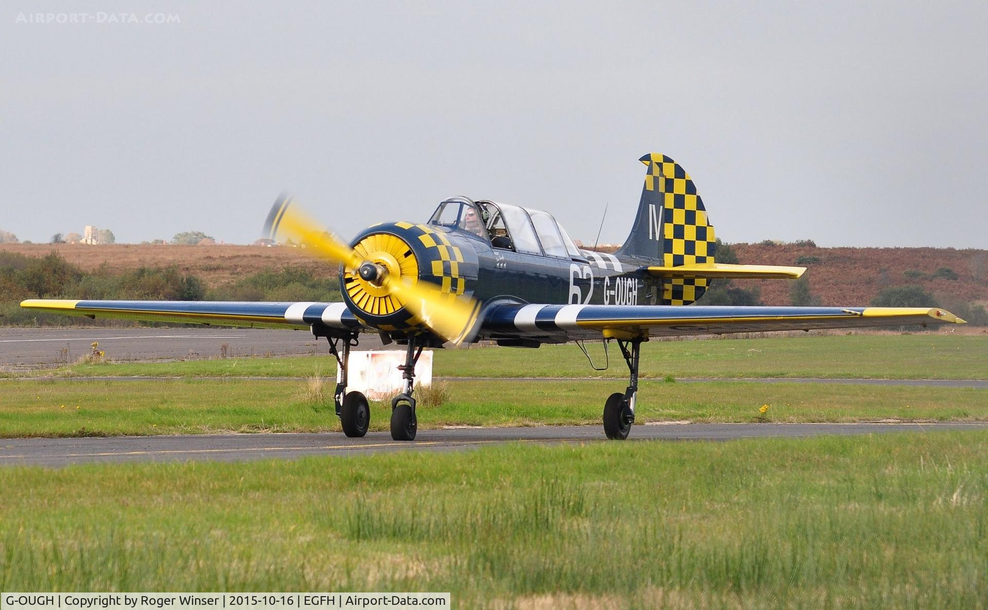 G-OUGH, 1987 Bacau Yak-52 C/N 877404, Resident Yak-52 returning from a local flight. Coded 74/JA on starboard side.