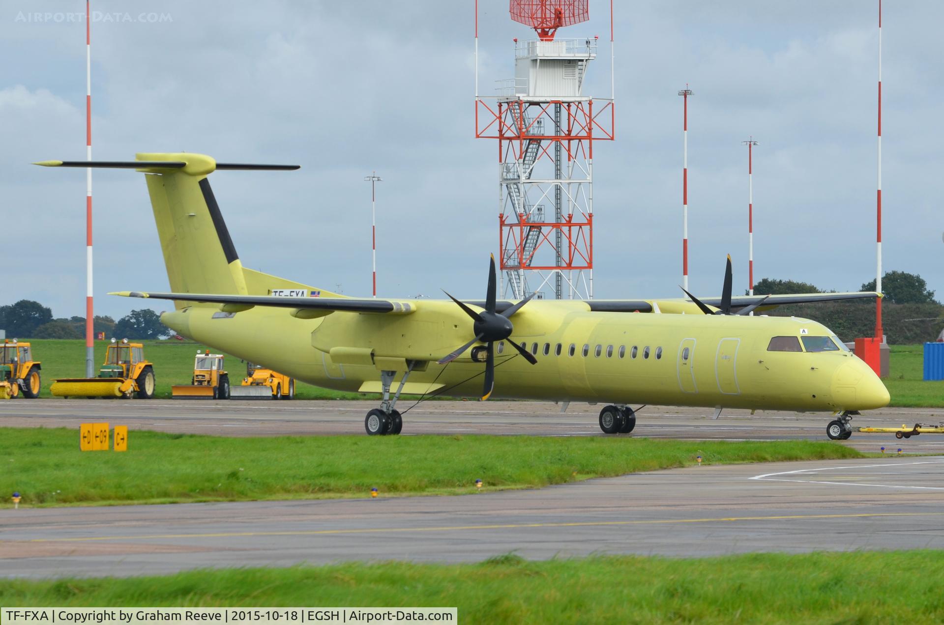 TF-FXA, 2001 Bombardier DHC-8-402 Q400 Dash 8 C/N 4022, Under tow at Norwich.