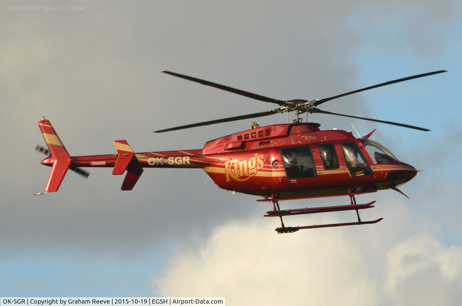 OK-SGR, 2013 Bell 407GX C/N 54426, About to land at Norwich.