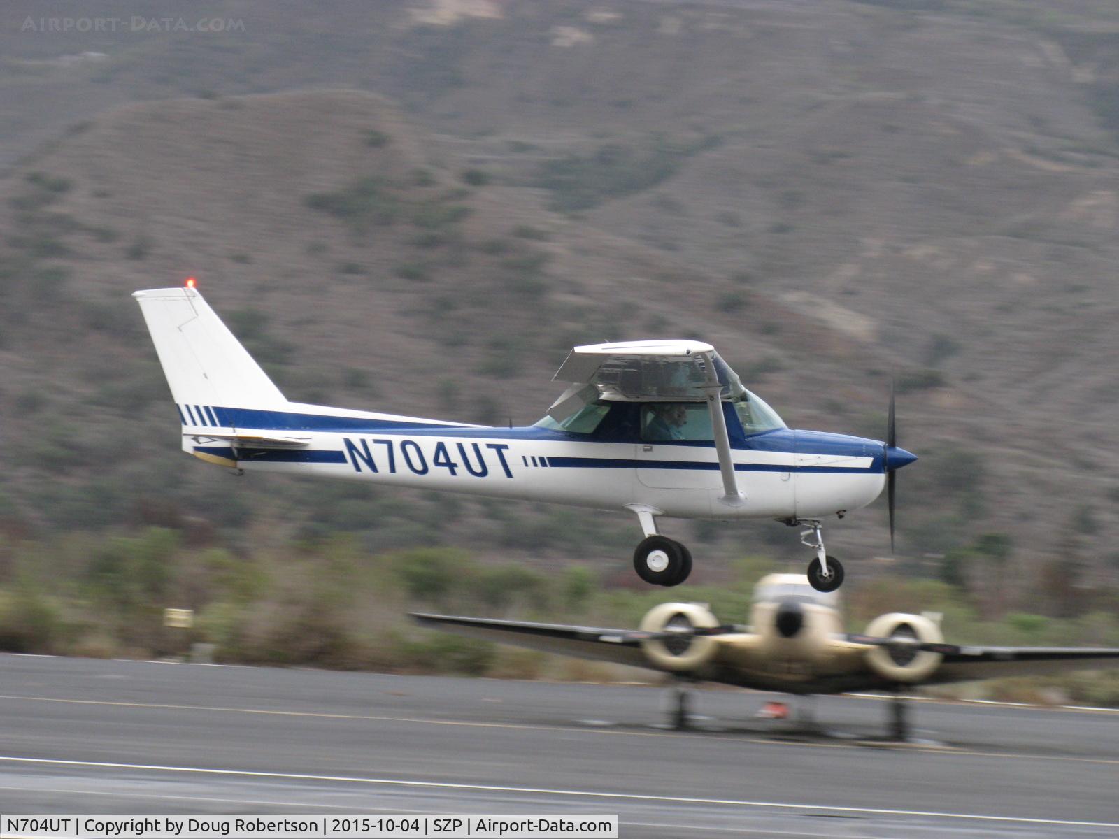 N704UT, 1976 Cessna 150M C/N 15078891, 1976 Cessna 150M, Continental O-200 100 Hp, on final Rwy 22 with balked landing go-around, near mid-field. Note full-flaps position