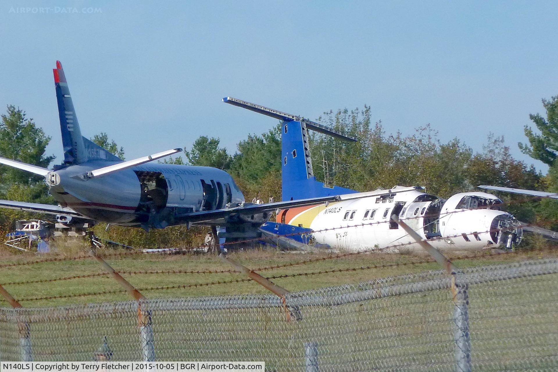 N140LS, De Havilland Canada DHC-8-102 Dash 8 C/N 140, Stored in the SW corner of Bangor International Airport in Maine
