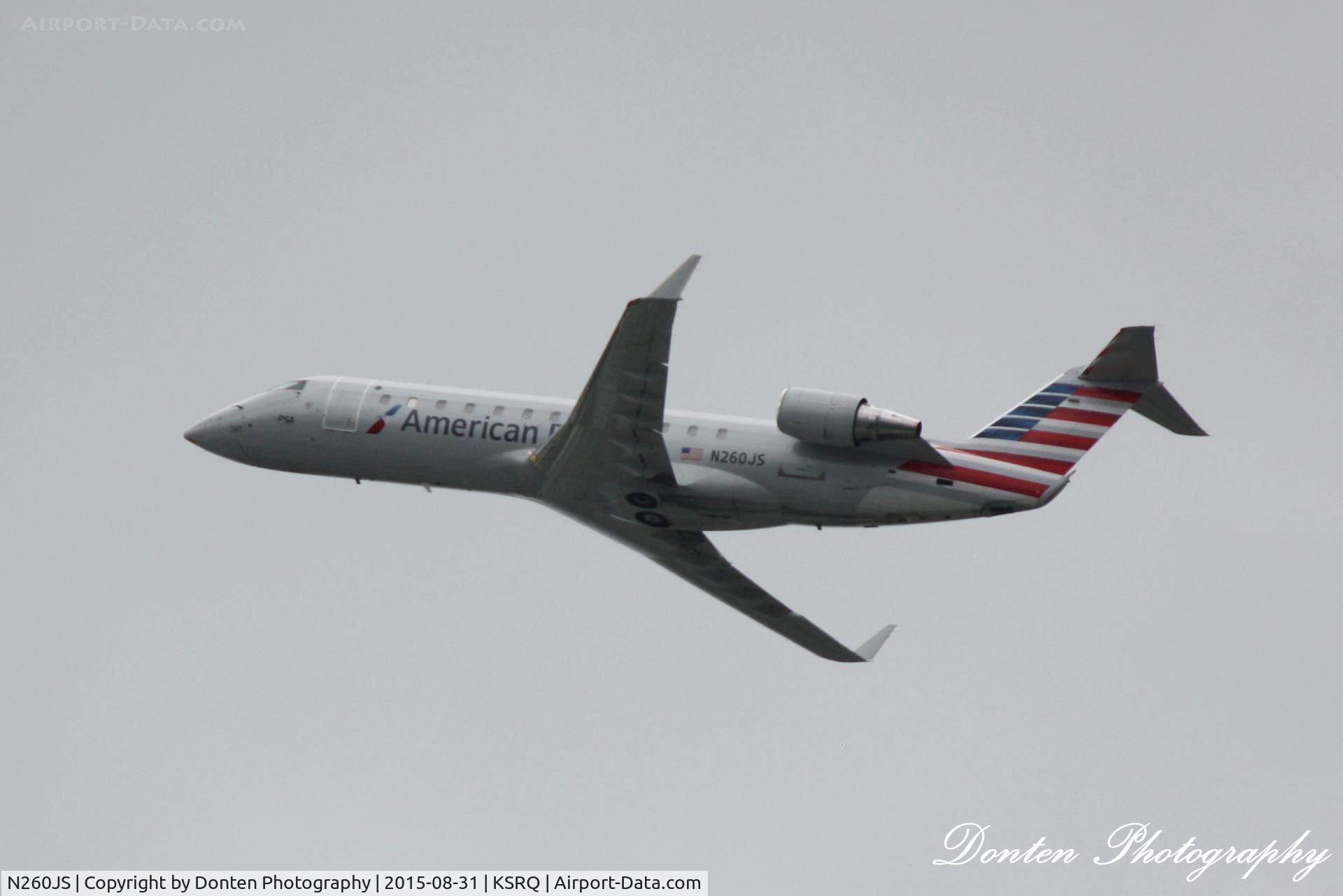 N260JS, 2004 Bombardier CRJ-200ER (CL-600-2B19) C/N 7957, American Flight 5139 operated by PSA (N260JS) departs Sarasota-Bradenton International Airport enroute to Charlotte-Douglas International Airport