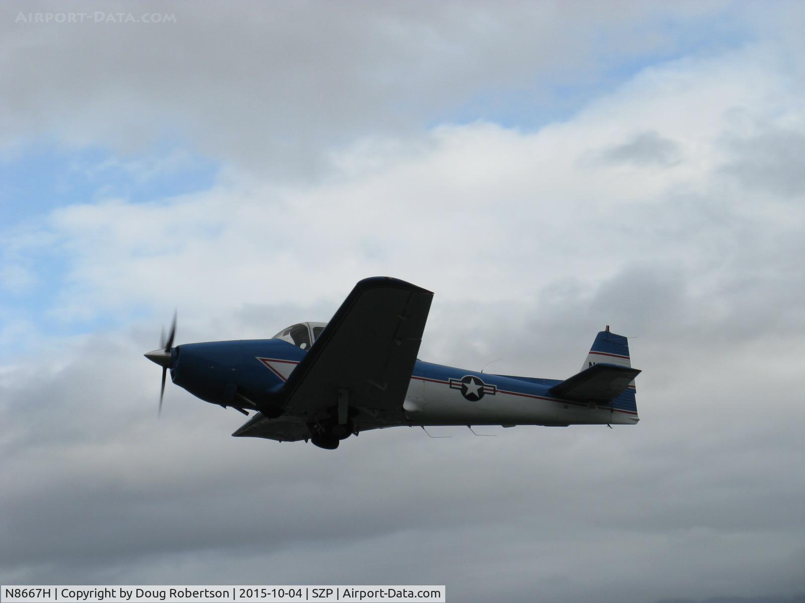 N8667H, 1947 North American Navion C/N NAV-4-667, 1947 North American NAVION, Continental IO-520 285 Hp upgrade, takeoff climb Rwy 22, gear coming up. Aircraft owner gives Young Eagles rides & ALWAYS does a preliminary solo test flight, as photographed.