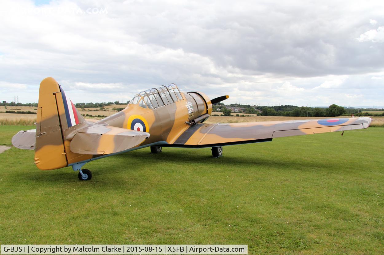 G-BJST, 1953 Canadian Car & Foundry T-6H Harvard Mk.4M C/N 14A-2429, Canadian Car & Foundry T-6H Harvard Mk4M in new camouflage finish by RS Paintworks at Fishburn Airfield, August 16th 2015.