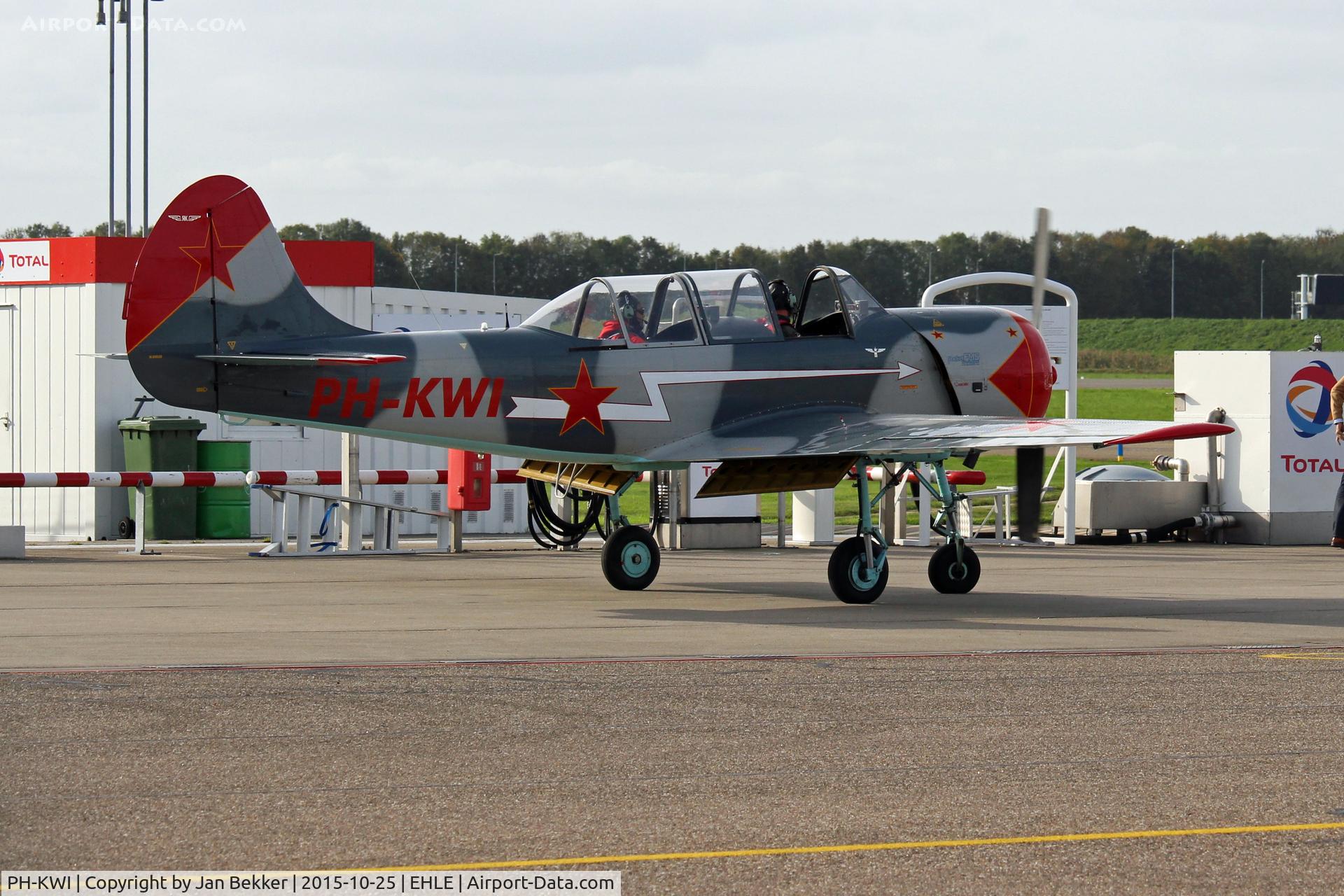 PH-KWI, 1989 Bacau Yak-52 C/N 899714, Lelystad Airport. Filling up