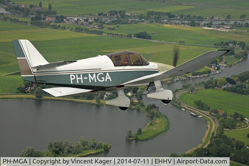 PH-MGA, 2004 Jodel DR-1050 Ambassadeur C/N 868, PH-MGA taken from a following Falco. Note the pods under the wings carrying the radiators for the cooling of the automotive engine. Aircraft flying around with temporary (and unpainted) engine cowlings.