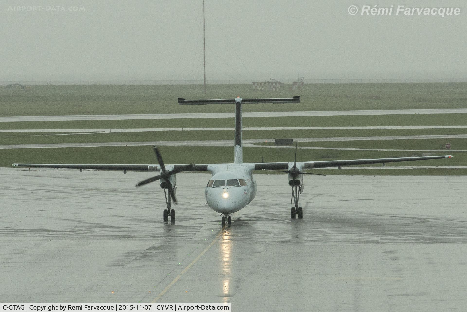 C-GTAG, 1990 De Havilland Canada DHC-8-301 Dash 8 C/N 200, Arriving to gate, C-wing.