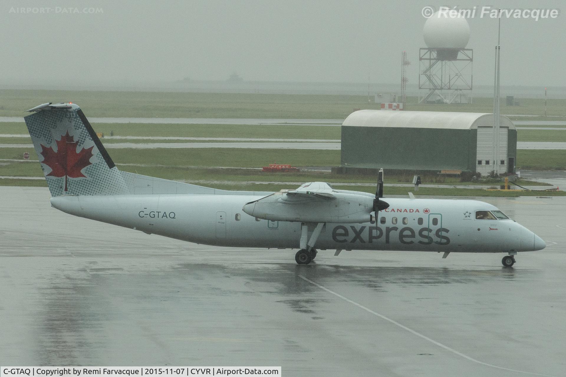 C-GTAQ, 1989 De Havilland Canada DHC-8-301 Dash 8 C/N 180, Arriving to gate, C-wing.
