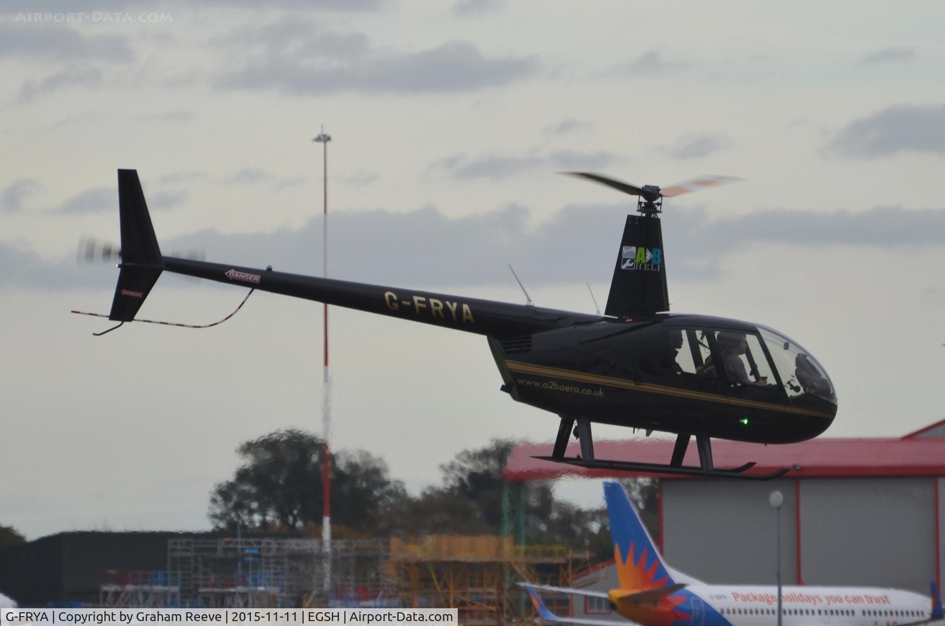 G-FRYA, 2006 Robinson R44 Raven II C/N 11605, Landing at Norwich.