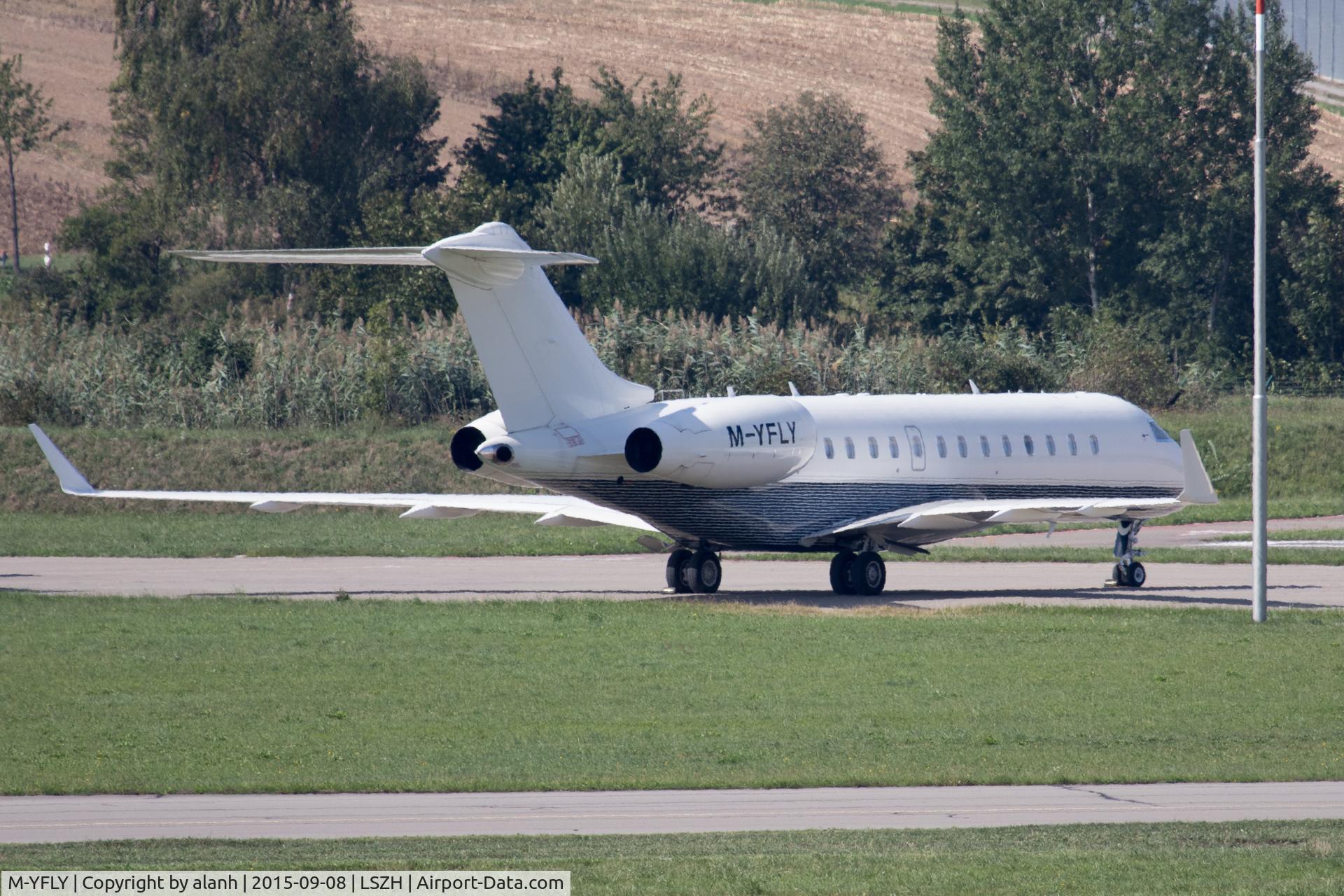 M-YFLY, Bombardier BD-700-1A10 Global Express C/N 9136, A bit of a paparazzo shot this as it was parked on the far side of the field and heat haze was very strong
