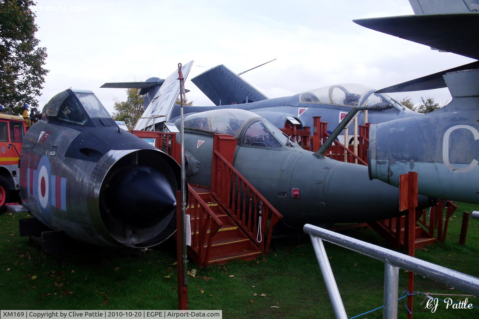 XM169, 1960 English Electric Lightning F.1A C/N 95056, Cockpit on external display, in RAF 23 Sqn colours,  at the Highland Aviation Museum located at Inverness airport EGPE Scotland. To its right is the nose of HS Buccanear S.2B XV867 ex RAF 208 Sqn at nearby RAF Lossiemouth.