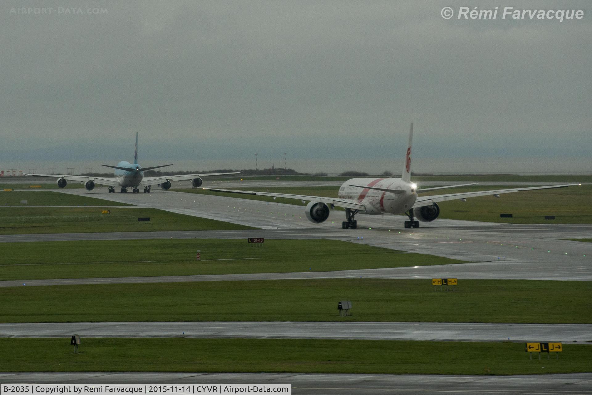 B-2035, 2012 Boeing 777-39L/ER C/N 38674, In foreground, taxiing to departure runway.