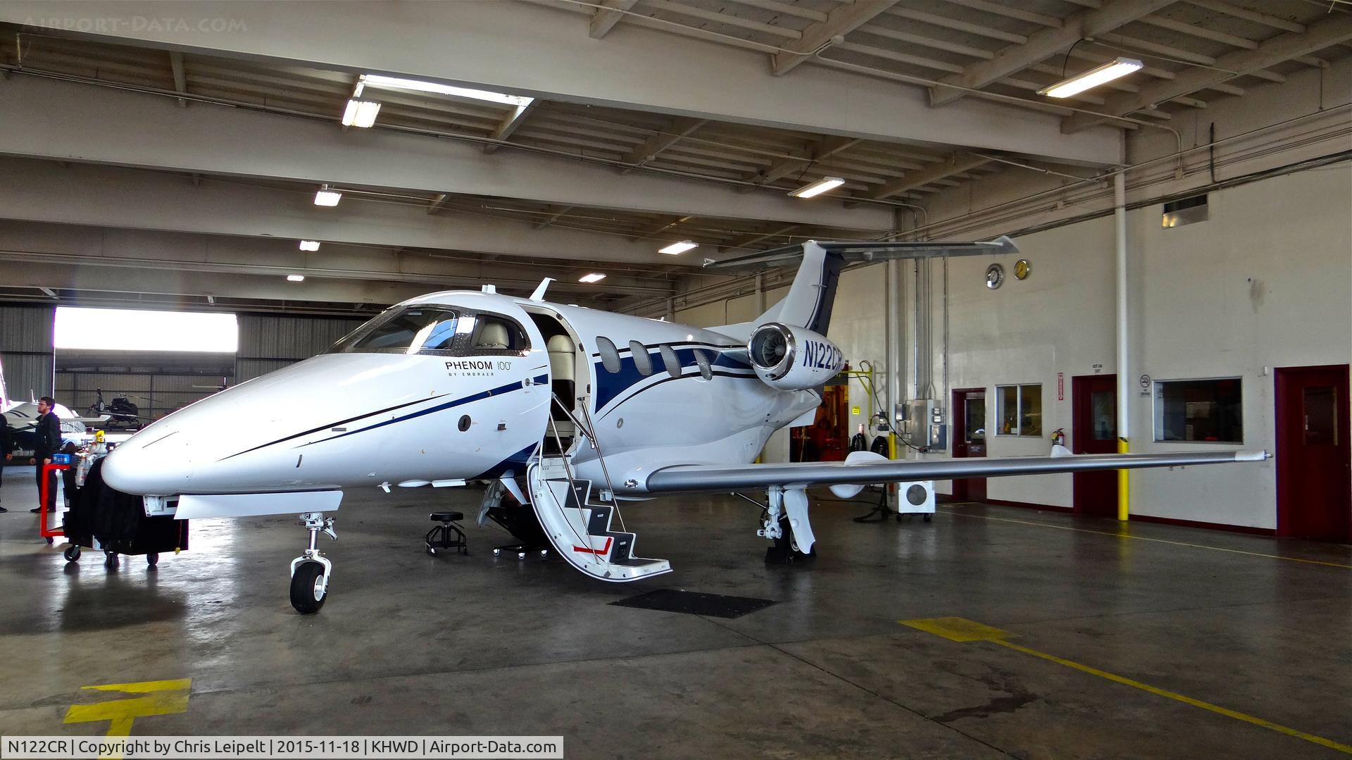 N122CR, 2013 Embraer EMB-500 Phenom 100 C/N 50000315, Christopher Ranch LLC (Gilroy, CA) 2013 Embraer Phenom 100 sitting inside the Mather hangar for maintenance at Hayward Executive Airport, Hayward, CA. Apparently it's de-icing boots (located on the wing) blew up mid-flight.