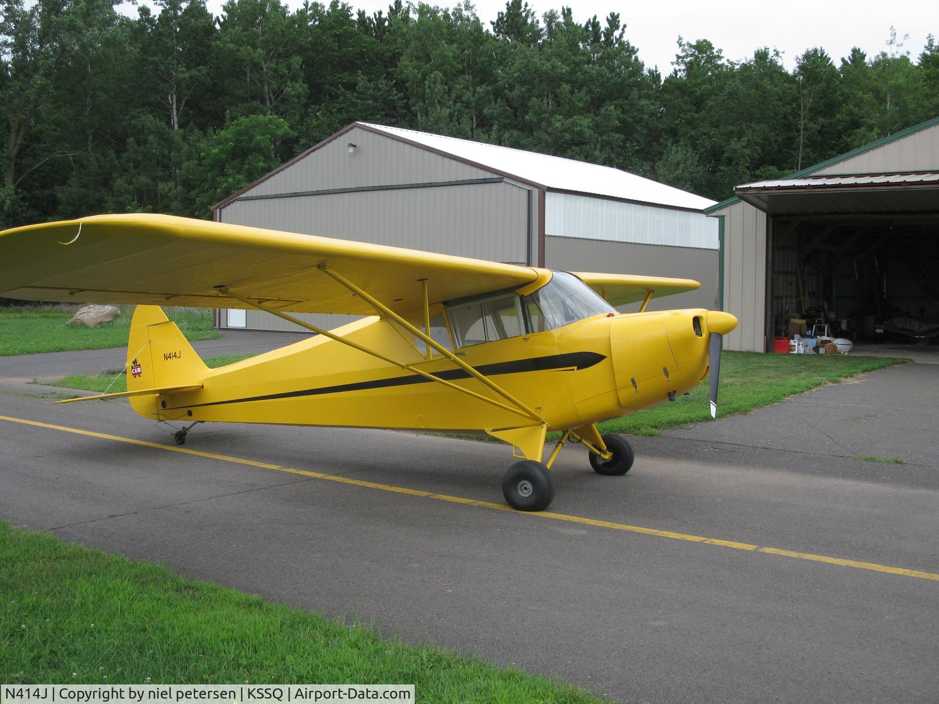 N414J, 1940 Piper J4A C/N 4-1299, C-85 w metal prop.  No electrics except gpu for starter.  Rebuild started 1976, finished 2012.