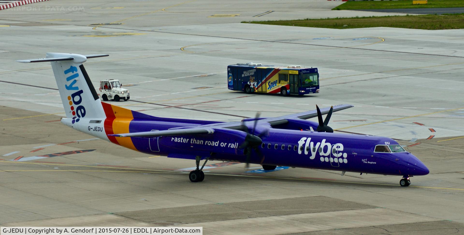 G-JEDU, 2004 De Havilland Canada DHC-8-402Q Dash 8 C/N 4089, Flybe, is here racing a bus and a tractor on the apron at Düsseldorf Int'l(EDDL)