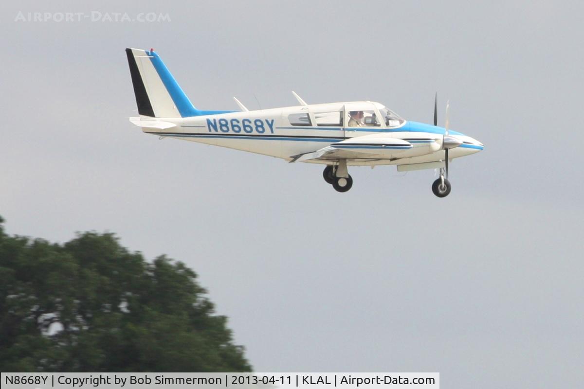 N8668Y, 1969 Piper PA-30 Twin Comanche C/N 30-1810, Arriving at Lakeland, FL with door already open!  Sun N Fun 2013.