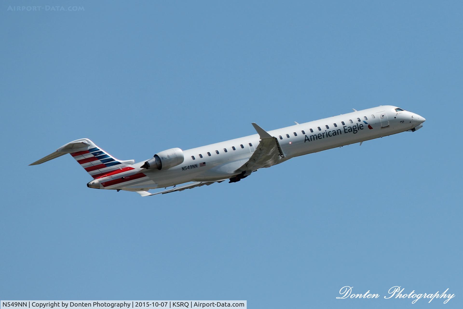 N549NN, 2014 Bombardier CRJ-900 (CL-600-2D24) C/N 15327, American Flight 5139 operated by PSA (N549NN) departs Sarasota-Bradenton International Airport enroute to Charlotte-Douglas International Airport