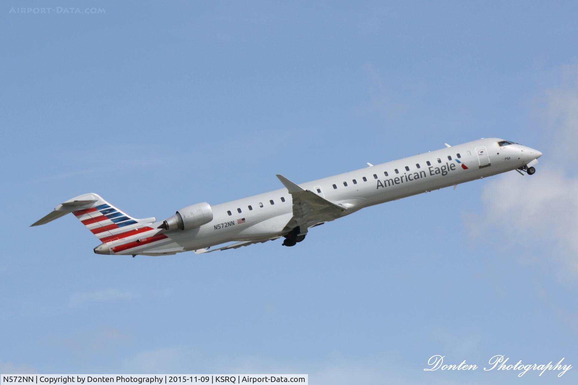 N572NN, 2015 Bombardier CRJ-900 (CL-600-2D24) C/N 15361, American Flight 5139 operated by PSA (N572NN) departs Sarasota-Bradenton International Airport enroute to Charlotte-Douglas International Airport