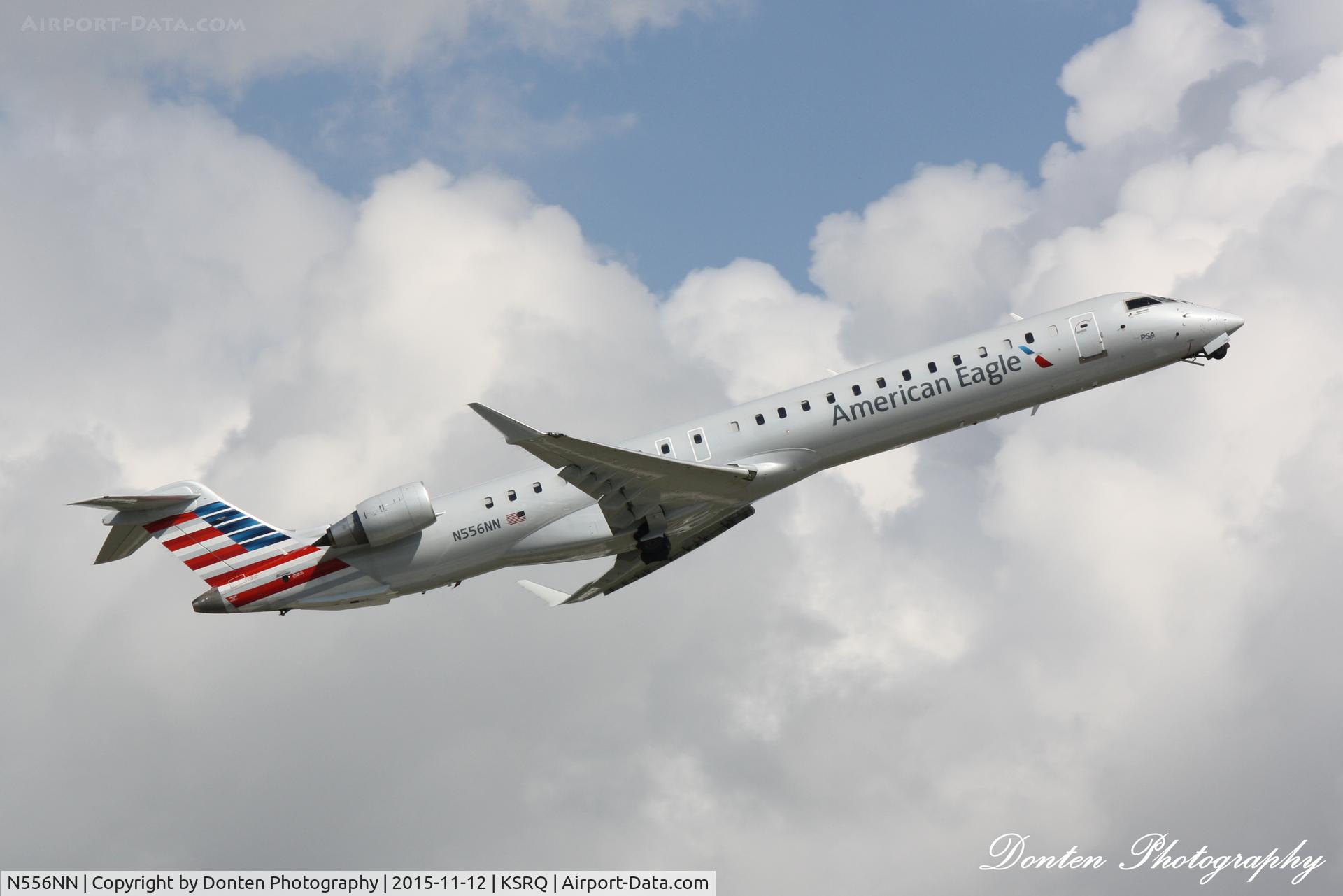 N556NN, 2014 Bombardier CRJ-900 (CL-600-2D24) C/N 15339, American Flight 5139 operated by PSA (N556NN) departs Sarasota-Bradenton International Airport enroute to Charlotte-Douglas International Airport