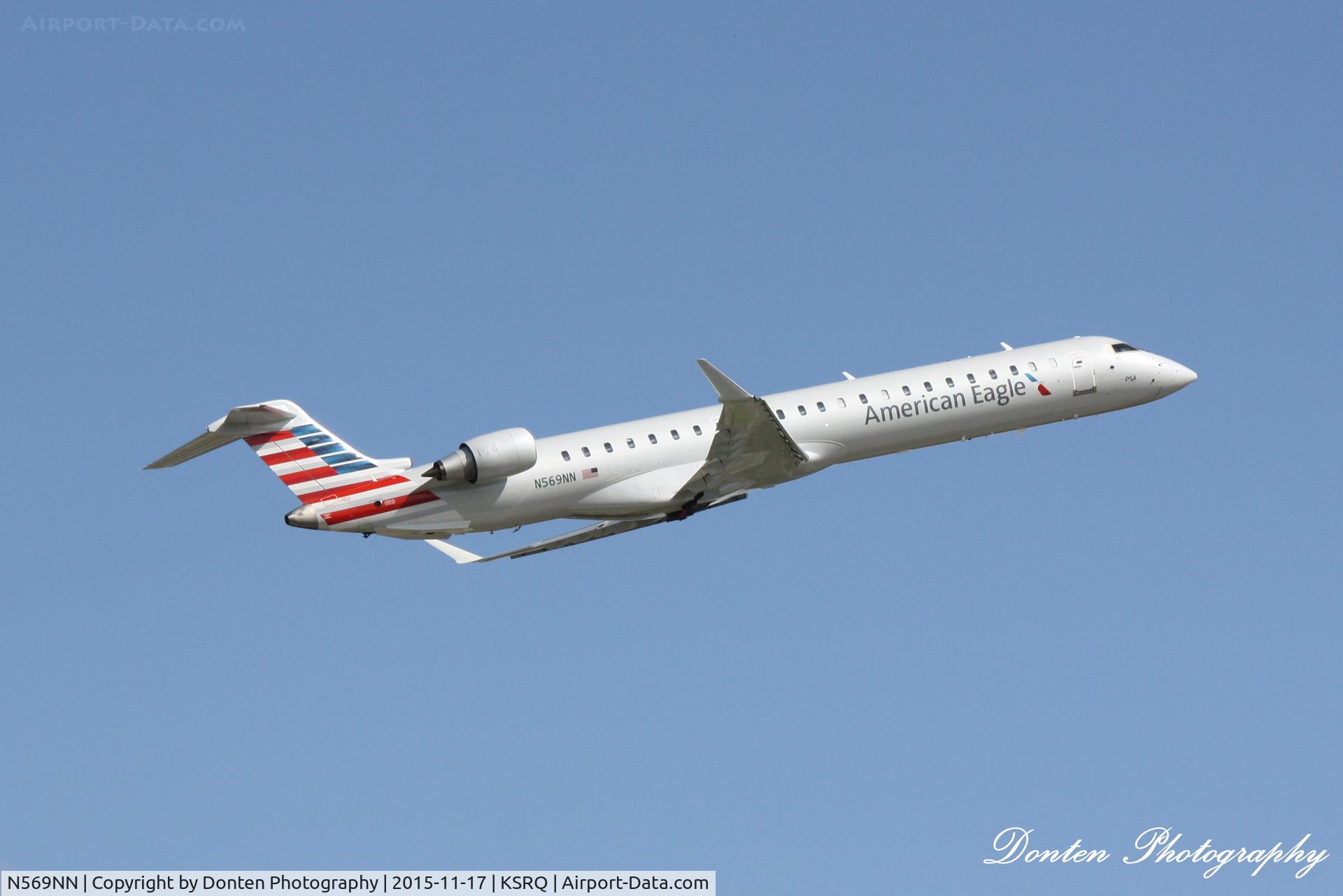 N569NN, 2015 Bombardier CRJ-900 (CL-600-2D24) C/N 15356, American Flight 5139 operated by PSA (N569NN) departs Sarasota-Bradenton International Airport enroute to Charlotte-Douglas International Airport