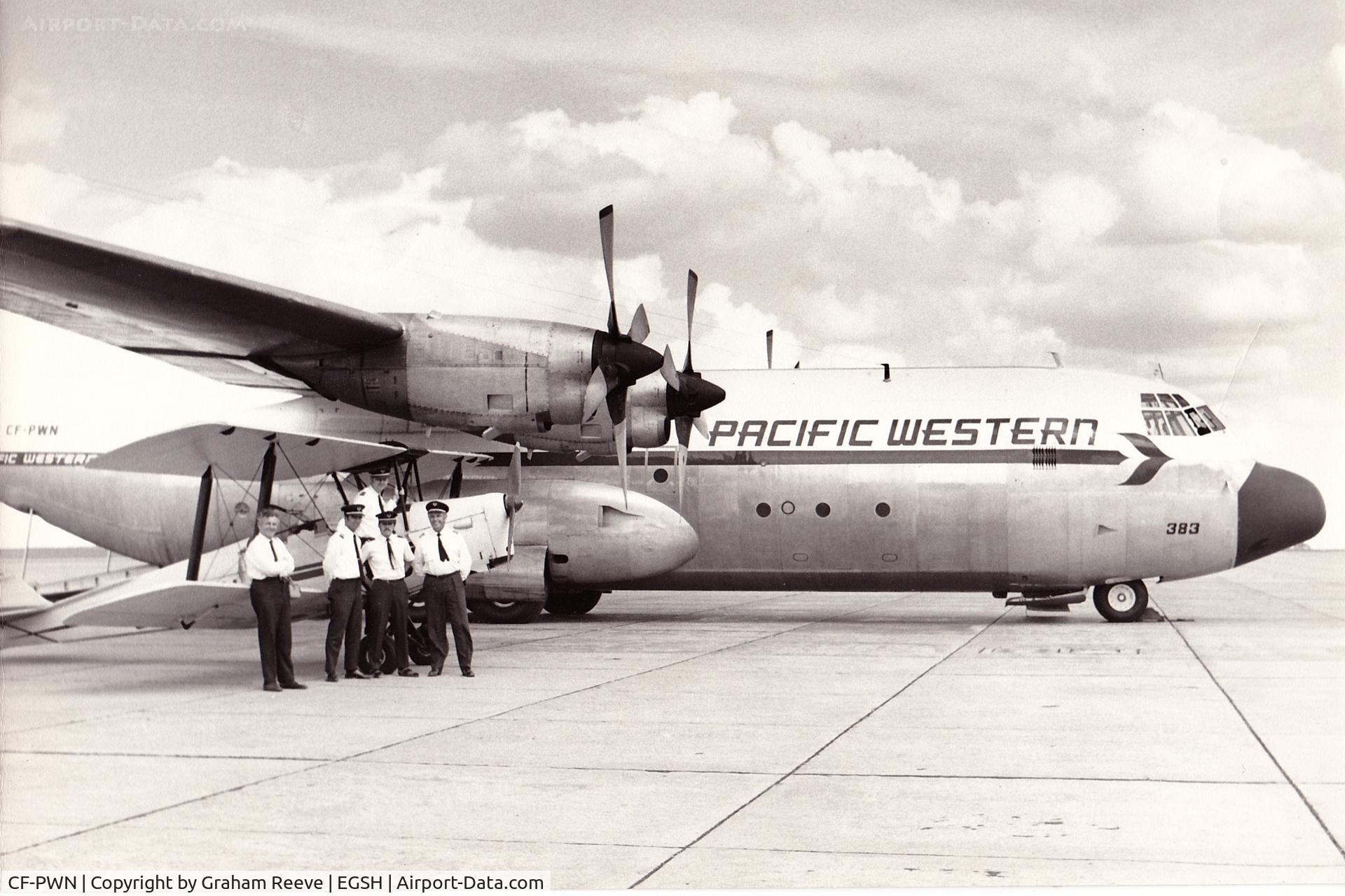 CF-PWN, 1966 Lockheed L-382B Hercules C/N 4129, I recently found this photo of CF-PWN at Norwich. G-ANMV Tiger Moth is pictured with the crew and CFI of the Norfolk and Norwich aero club.