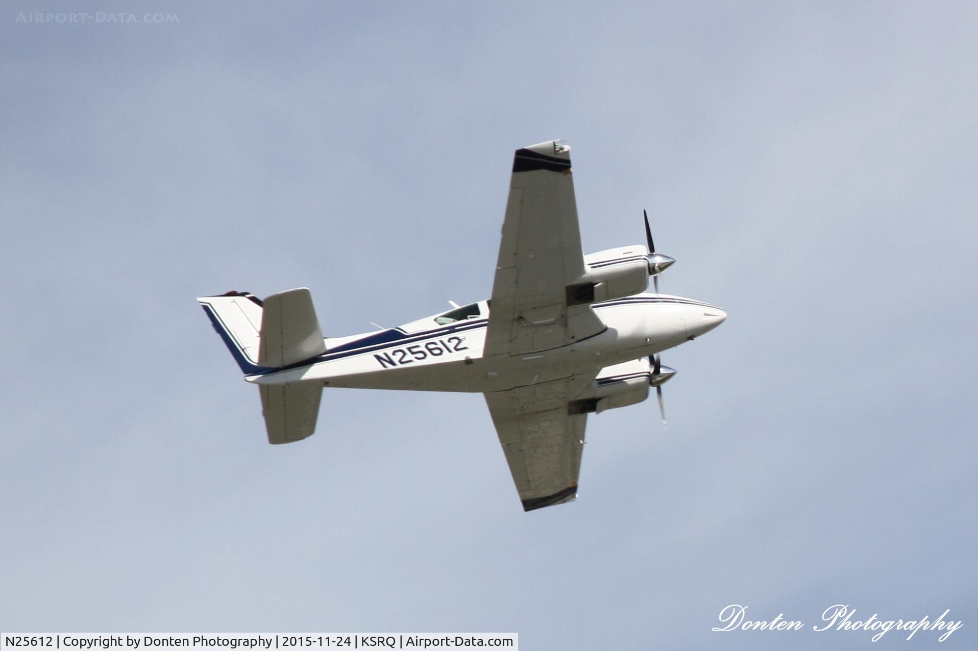 N25612, 1973 Beech E-55 Baron C/N TE-897, Beechcraft Baron (N25612) departs Sarasota-Bradenton International Airport enroute to Auburn-Opelika Airport