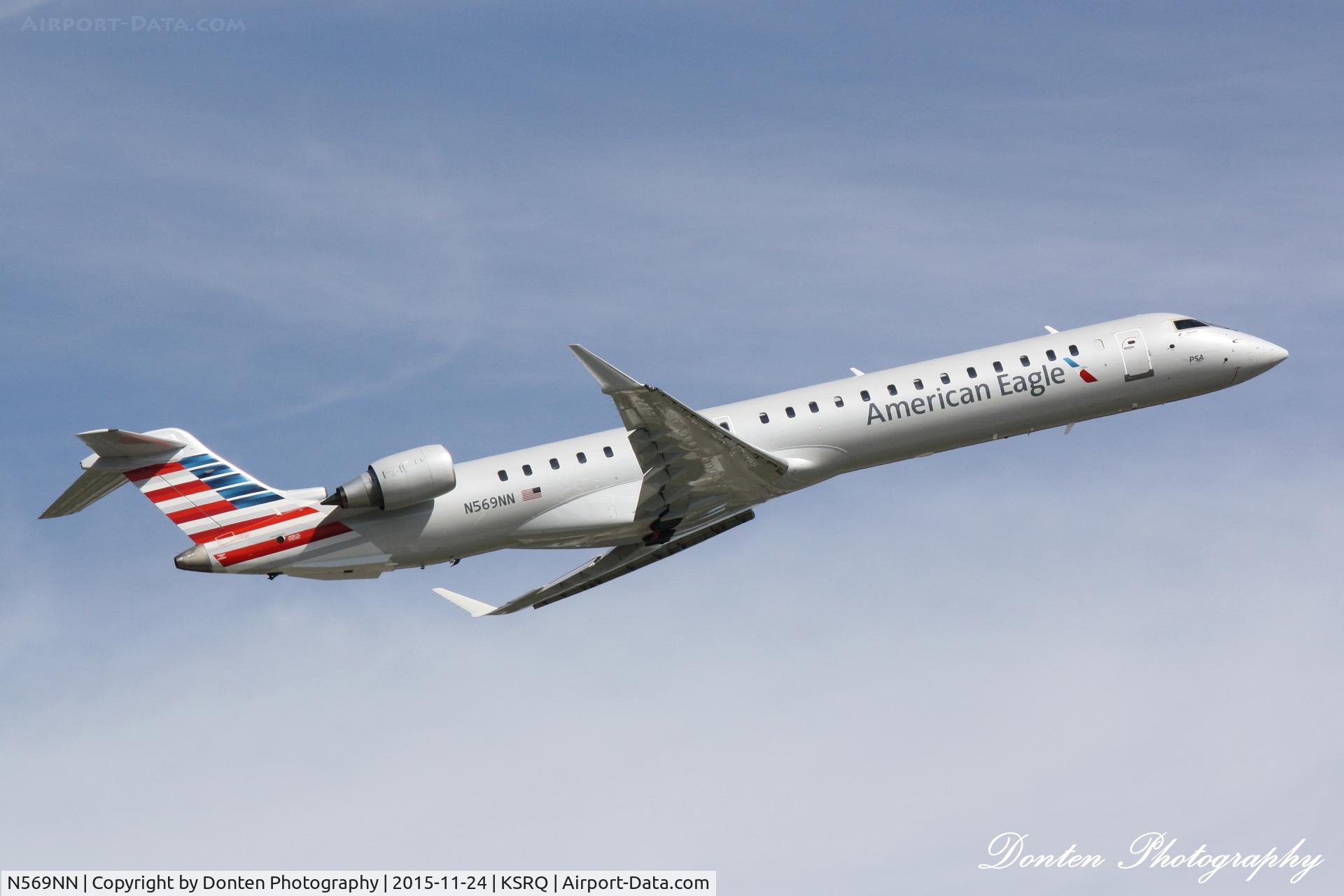 N569NN, 2015 Bombardier CRJ-900 (CL-600-2D24) C/N 15356, American Flight 5139 operated by PSA (N569NN) departs Sarasota-Bradenton International Airport enroute to Charlotte-Douglas International Airport