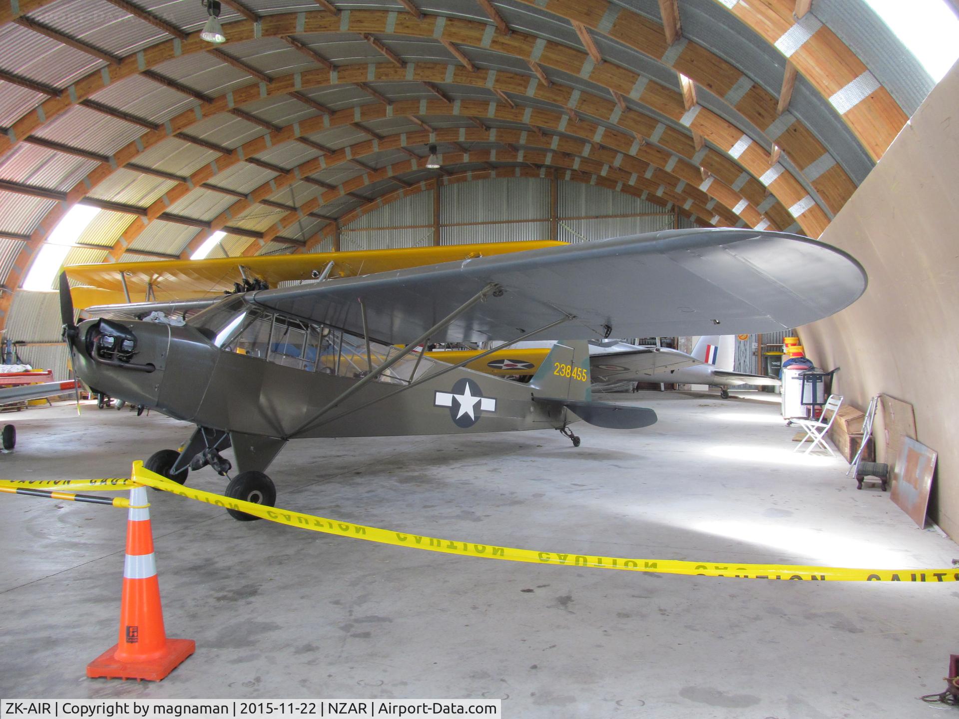 ZK-AIR, 1942 Piper L-4A Grasshopper (J3C-65 Cub) C/N 9024, In hangar at Ardmore on open day