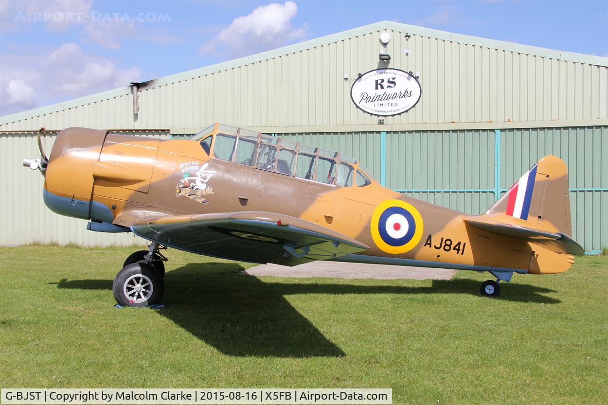 G-BJST, 1953 Canadian Car & Foundry T-6H Harvard Mk.4M C/N 14A-2429, Canadian Car & Foundry T-6H Harvard Mk4M in new camouflage finish by RS Paintworks at Fishburn Airfield, August 16th 2015.