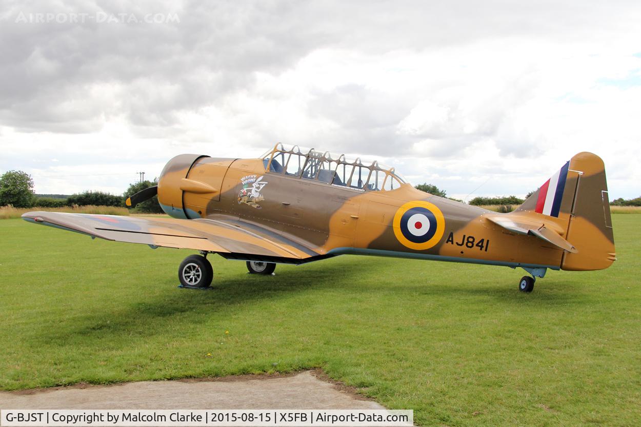 G-BJST, 1953 Canadian Car & Foundry T-6H Harvard Mk.4M C/N 14A-2429, Canadian Car & Foundry T-6H Harvard Mk4M in new camouflage finish by RS Paintworks at Fishburn Airfield, August 16th 2015.