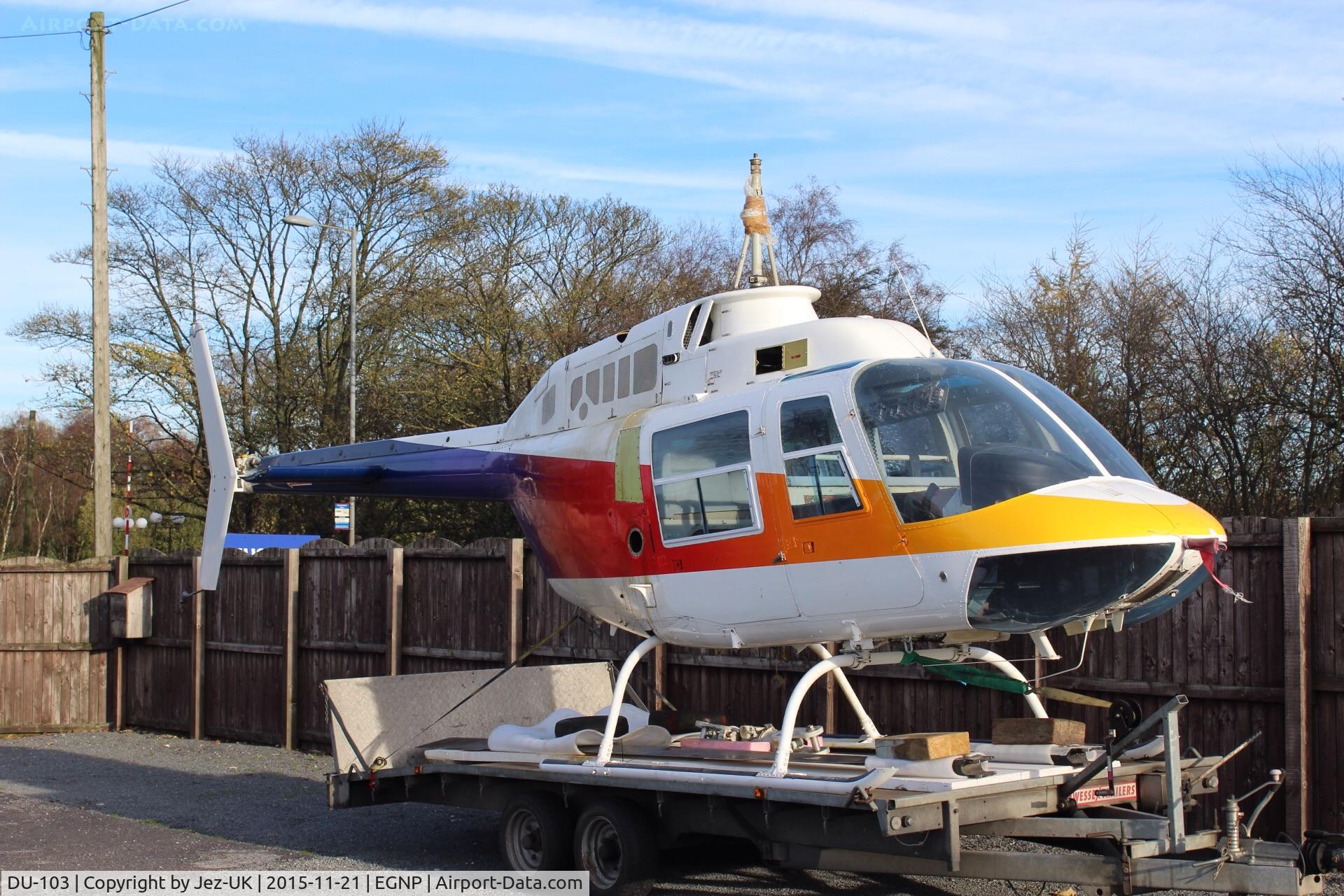 DU-103, 1973 Bell 206B JetRanger II C/N 1193, airframe parked on trailer at Coneypark heliport next to LBA in UK(EGNM) with rotors and parts missing, no identification and not totally confirmed to be c/n 1193,