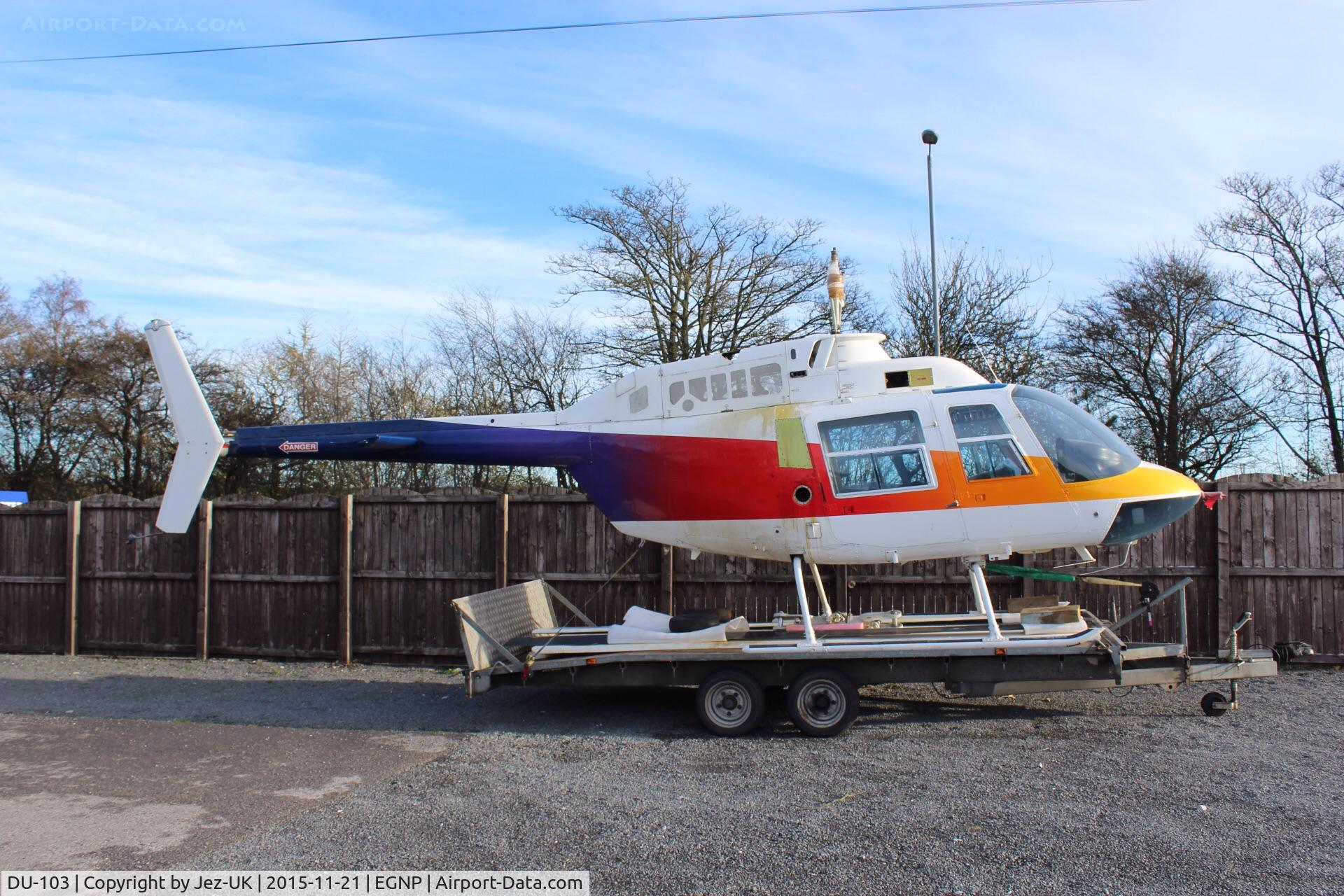 DU-103, 1973 Bell 206B JetRanger II C/N 1193, airframe parked on trailer at Coneypark heliport next to LBA in UK(EGNM) with rotors and parts missing, no identification and not totally confirmed to be c/n 1193,