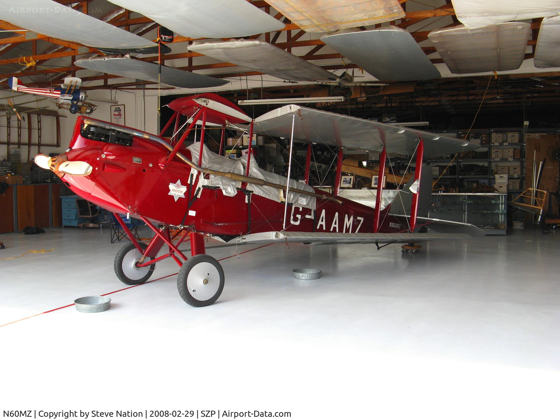 N60MZ, 1930 De Havilland DH-60G Gypsy Moth C/N 1293, 1930 de Havilland DH-60G Gypsy Moth as NX60MZ and also carrying British registration G-AAMZ @ Santa Paula, CA home base (with wings folded and in sunny hangar)