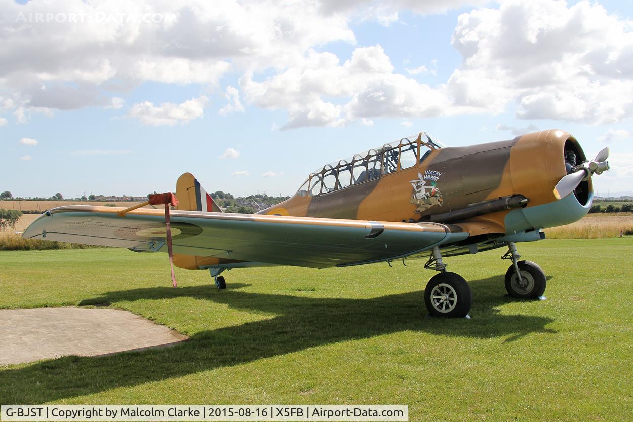 G-BJST, 1953 Canadian Car & Foundry T-6H Harvard Mk.4M C/N 14A-2429, Canadian Car & Foundry T-6H Harvard Mk4M in new camouflage finish by RS Paintworks at Fishburn Airfield, August 16th 2015.