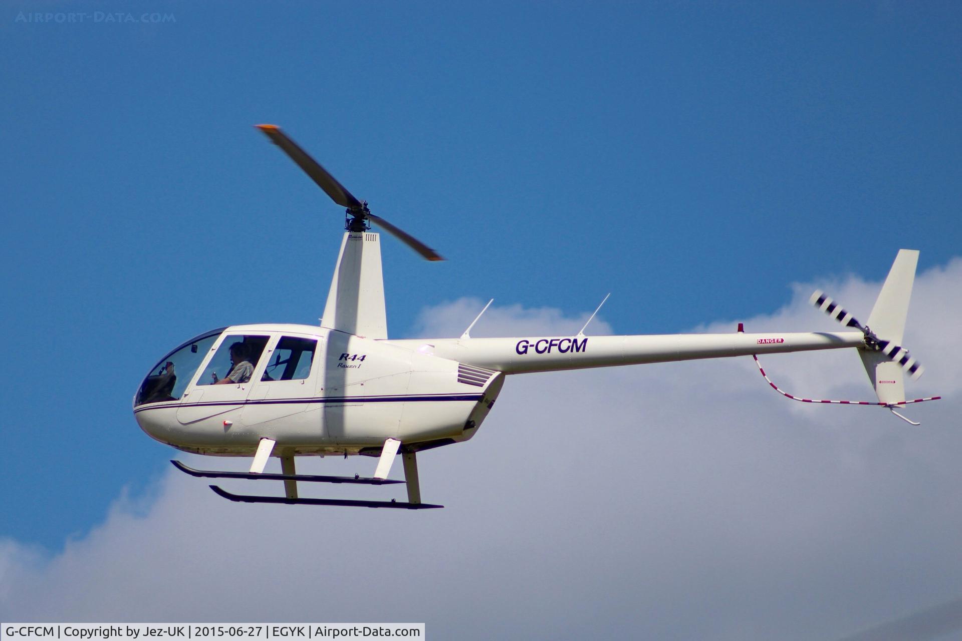 G-CFCM, 2006 Robinson R44 Raven I C/N 1635, about to set down at Yorkshire Air Museum,