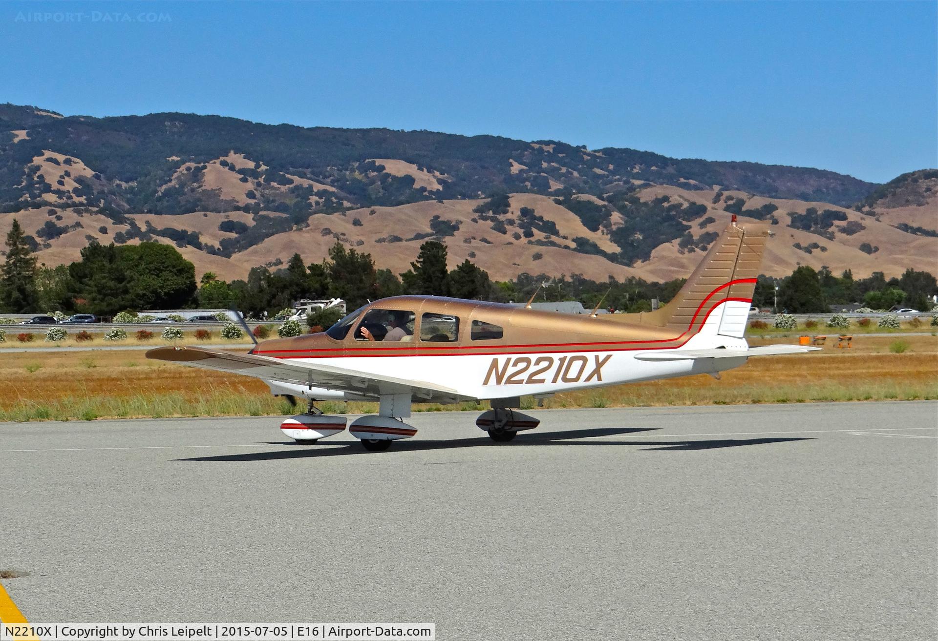 N2210X, 1979 Piper PA-28-161 C/N 28-7916351, Locally-based 1979 Piper PA-28-161 taxing out for departure from the south tie downs at South County Airport, San Martin, CA.