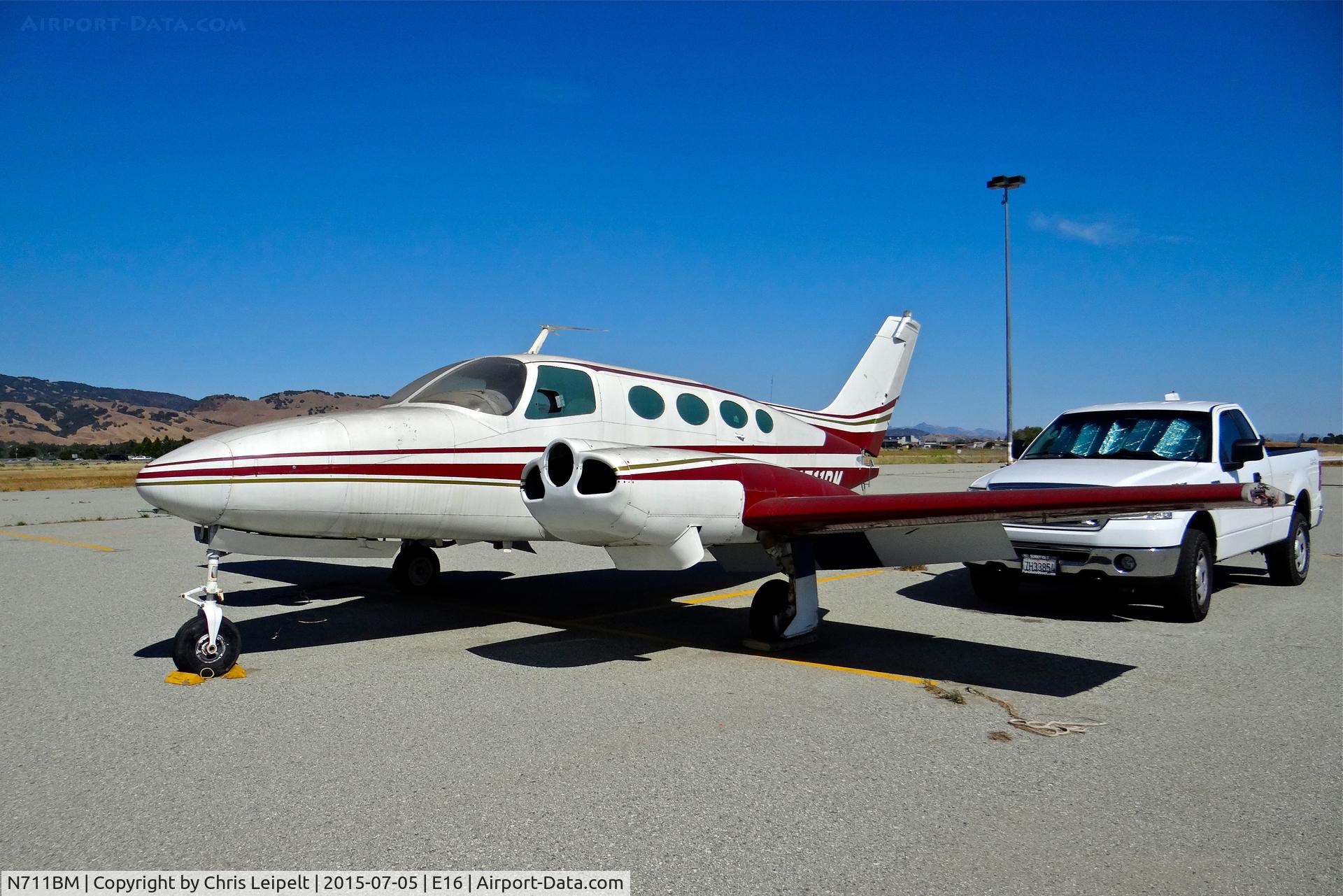 N711BM, 1966 Cessna 411 C/N 411-0220, Poor old locally-based 1966 Cessna 411 (minus props) parked at the south tie downs at South County Airport, San Martin, CA. It is one of the two rotting C411s at E16 and this one hasn't been touched in years.