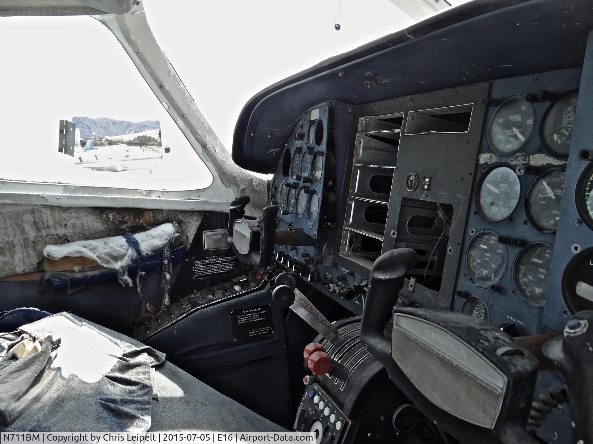 N711BM, 1966 Cessna 411 C/N 411-0220, Cockpit shot of a poor old locally-based 1966 Cessna 411 parked at the south tie downs at South County Airport, San Martin, CA. It is one of the two rotting C411s at E16 and this one hasn't been touched in years.