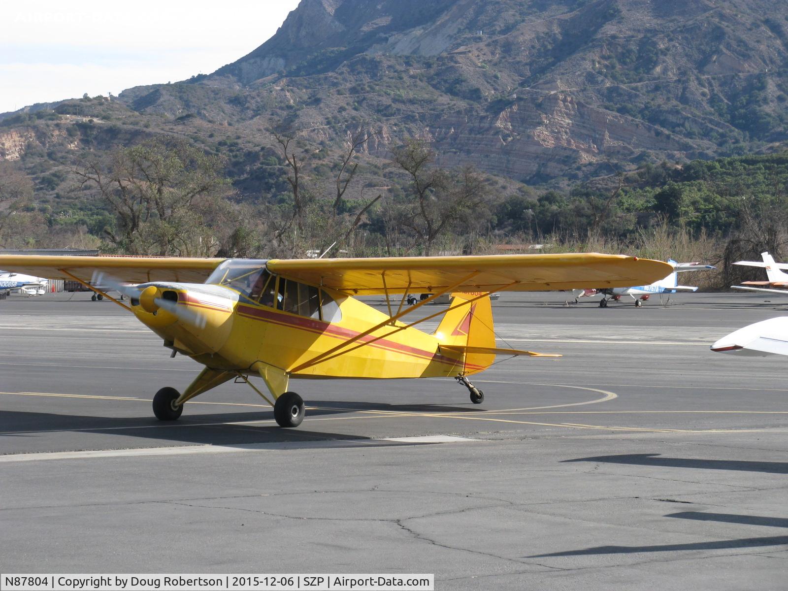 N87804, 1946 Piper PA-12 Super Cruiser C/N 12-5, 1946 Piper PA-12 SUPER CRUISER, Lycoming O-290 135 Hp upgrade, owner received his Private Pilot instruction from SZP's Pete Mason, CFI. Alaska visitor. Taxi to transient ramp.