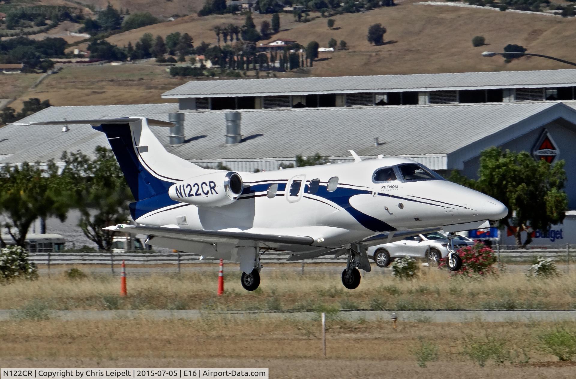 N122CR, 2013 Embraer EMB-500 Phenom 100 C/N 50000315, Locally-based 2013 Embraer Phenom 100 landing at South County Airport, San Martin, CA. Owned by Christopher Ranch LLC, a garlic farm out of nearby Gilroy.