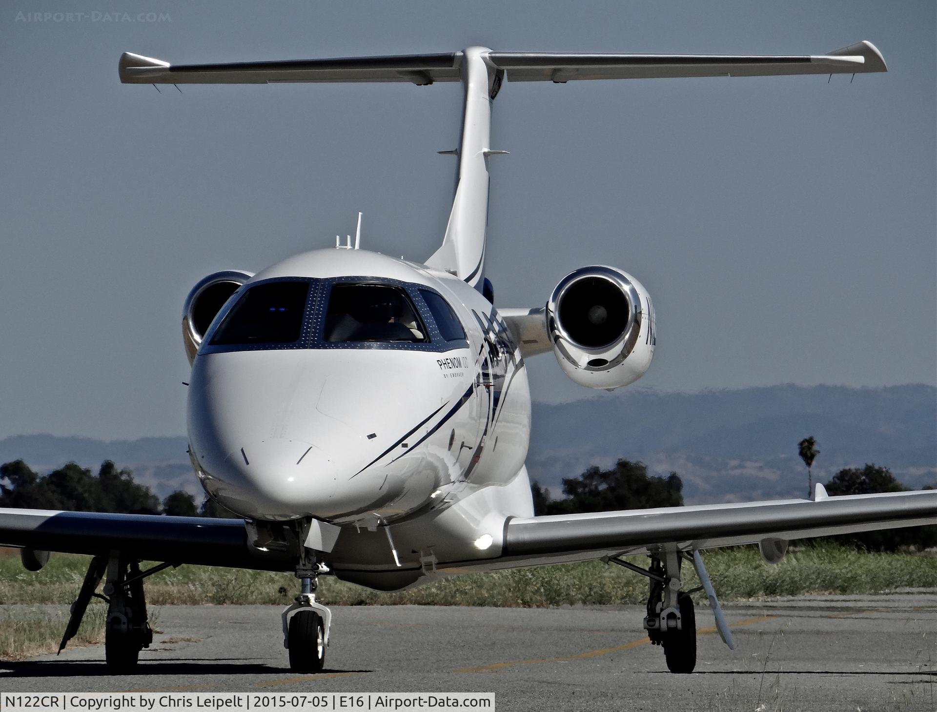 N122CR, 2013 Embraer EMB-500 Phenom 100 C/N 50000315, Locally-based 2013 Embraer Phenom 100 taxing to its hangar at South County Airport, San Martin, CA. Owned by Christopher Ranch LLC, a garlic farm out of nearby Gilroy.