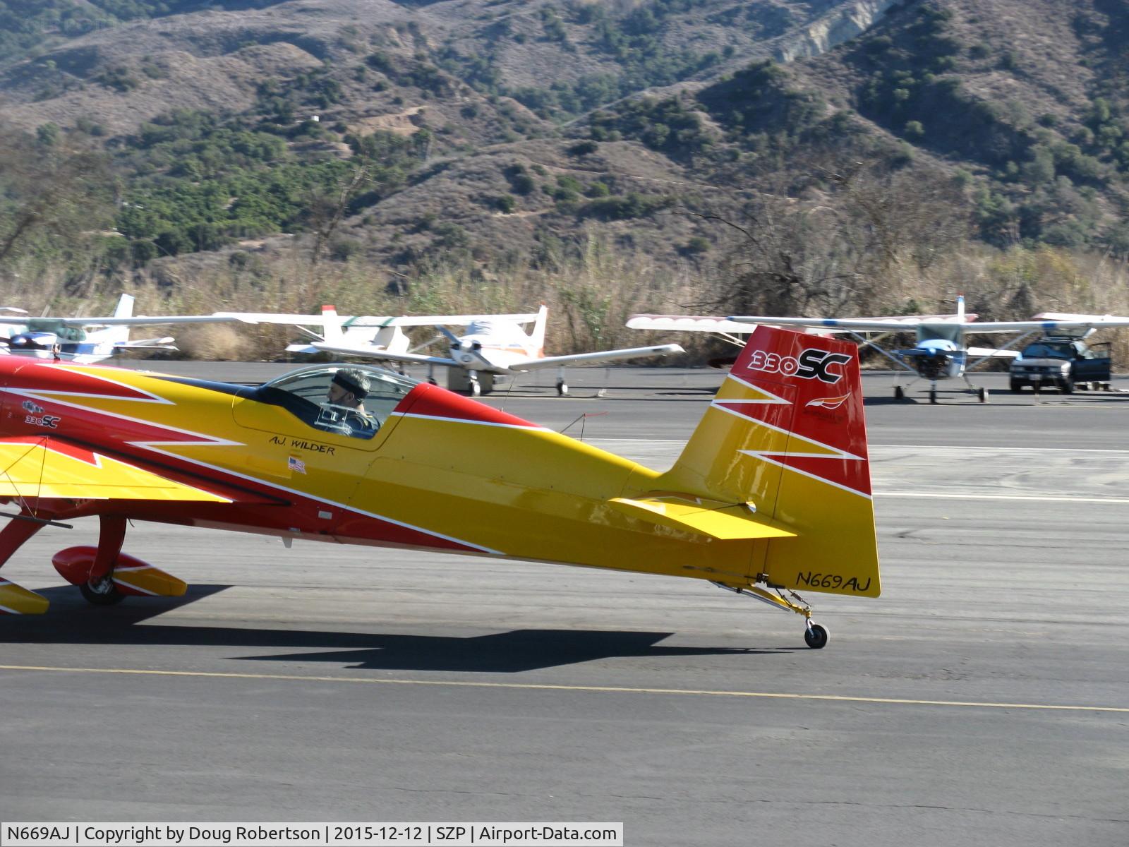 N669AJ, Extra EA-330SC C/N SC001E, Extraflugzeugproduktions EA300/SC, Lycoming AEIO-540-L1B5 300 Hp, taxi back, apparently Experimental class customized? some control surfaces apparent changes? Note dfferent, enlarged area rudder shape, Formerly N300EX.
