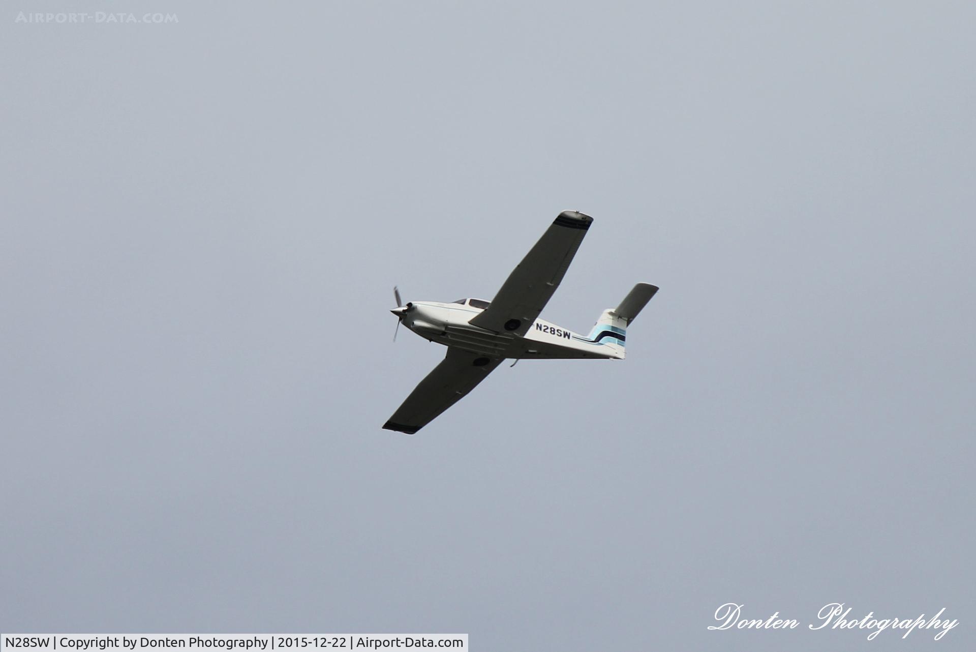 N28SW, 1979 Piper PA-28RT-201T Turbo Arrow IV C/N 28R-7931308, Piper Cherokee (N28SW) flies over Manasota Beach