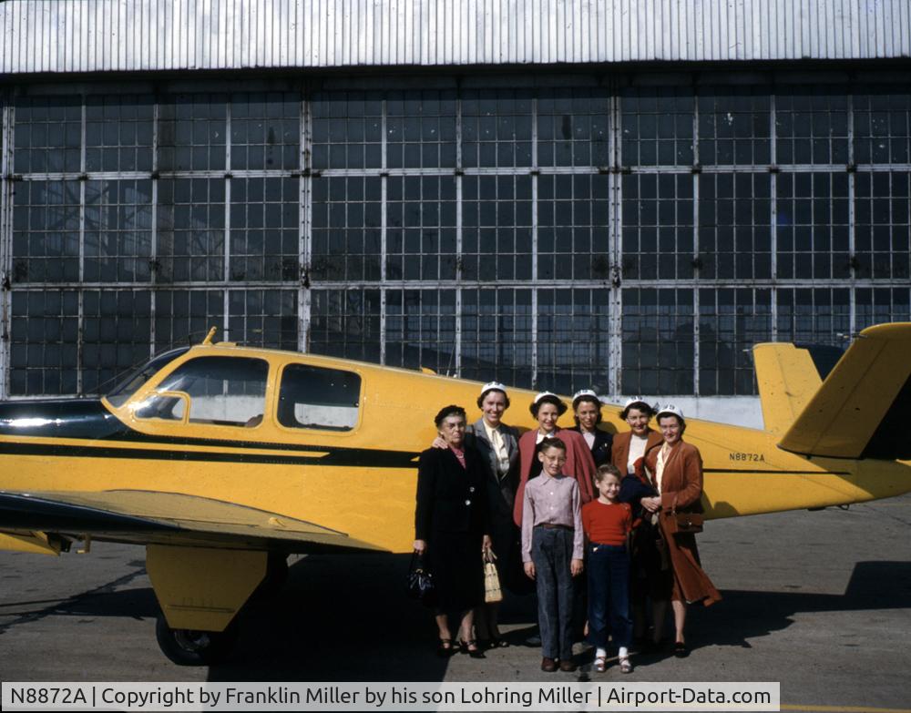 N8872A, 1950 Beechcraft V35 Bonanza C/N D-2527, This picture shows the airplane in 1952 after painting.  The picture was taken at the Meadville, Pa airport.  Beside the airplane are a woman's group as well as Franklin's wife on the far right and his children in the front.