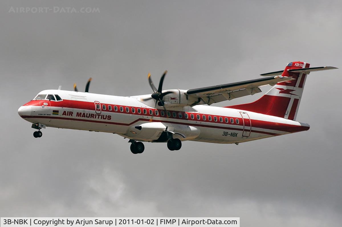 3B-NBK, 1999 ATR 72-212A C/N 595, 'Coin de Mire' approaching rwy 14 at Plaisance on a cloudy summer morning.