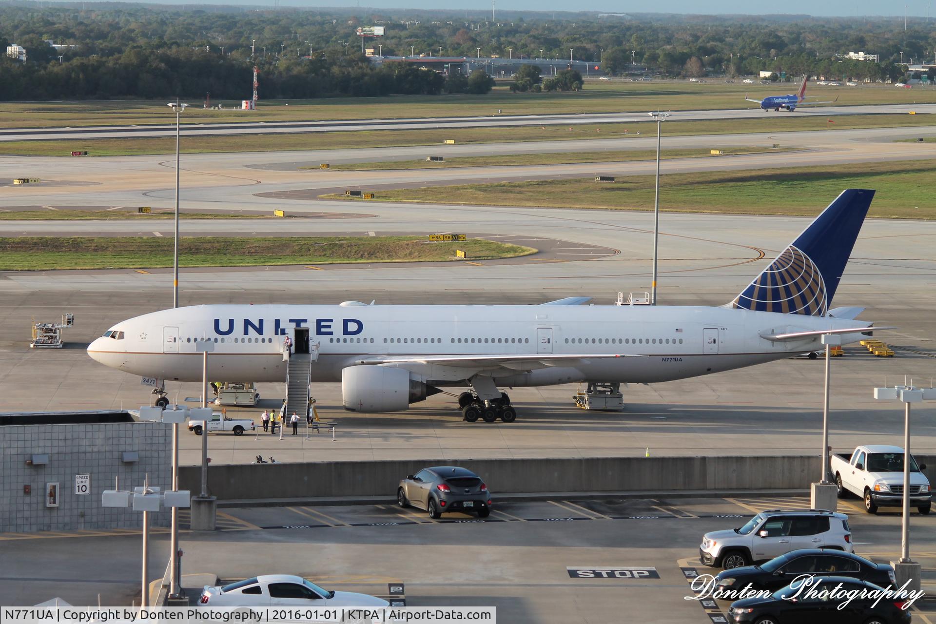 N771UA, 1995 Boeing 777-222 C/N 26932, United Flight 2223 (N771UA) sits on the ramp at Tampa International Airport providing charter service for Northwestern University following the Outback Bowl
