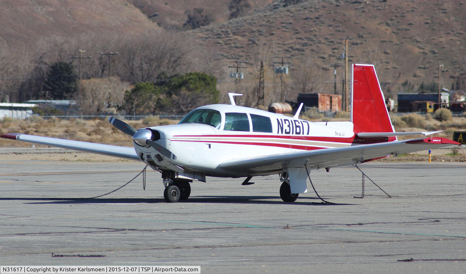 N31617, 1965 Mooney M20E C/N 515, At base.
