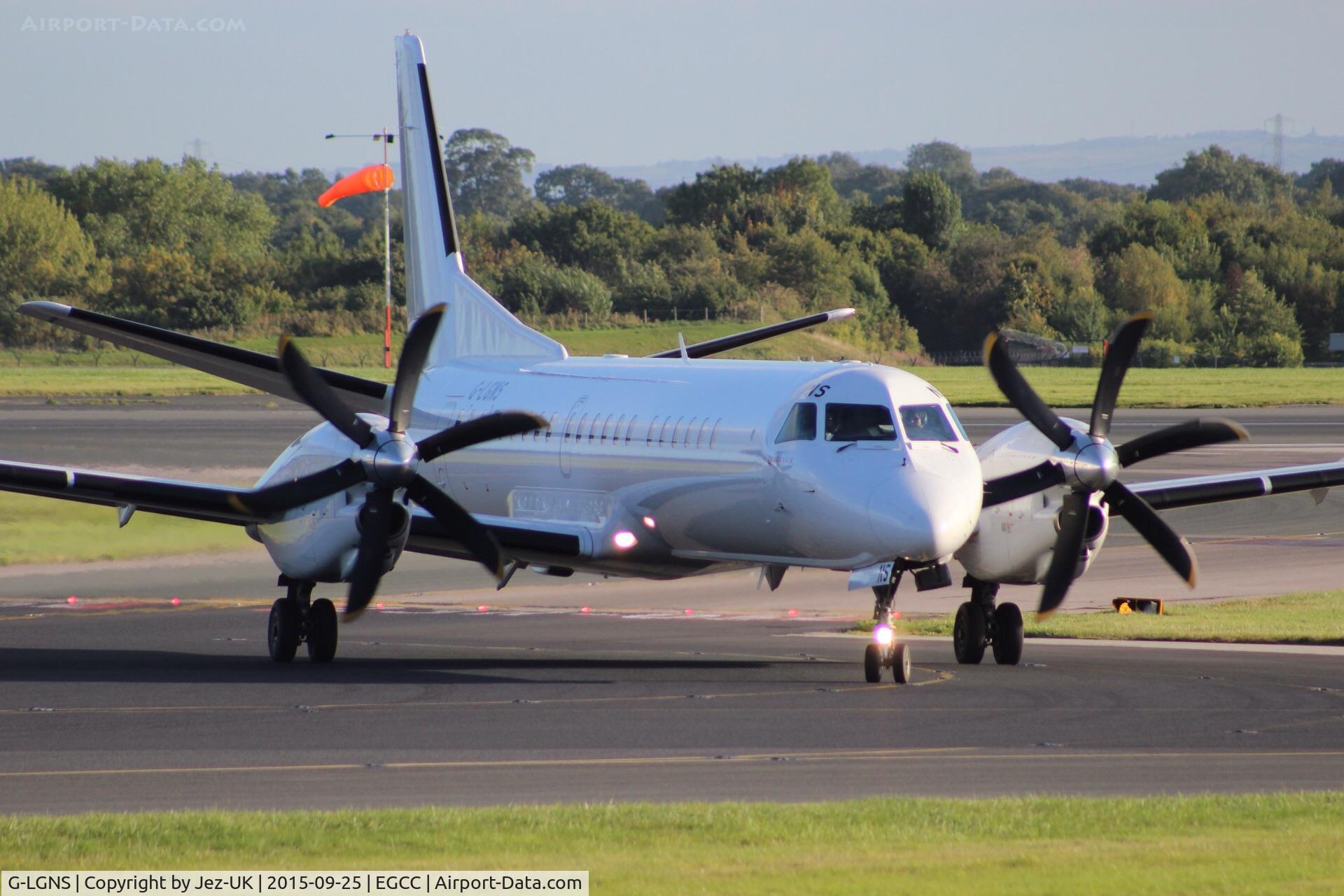 G-LGNS, 1996 Saab 2000 C/N 2000-041, turning off runway 23r to taxi to terminal T3,