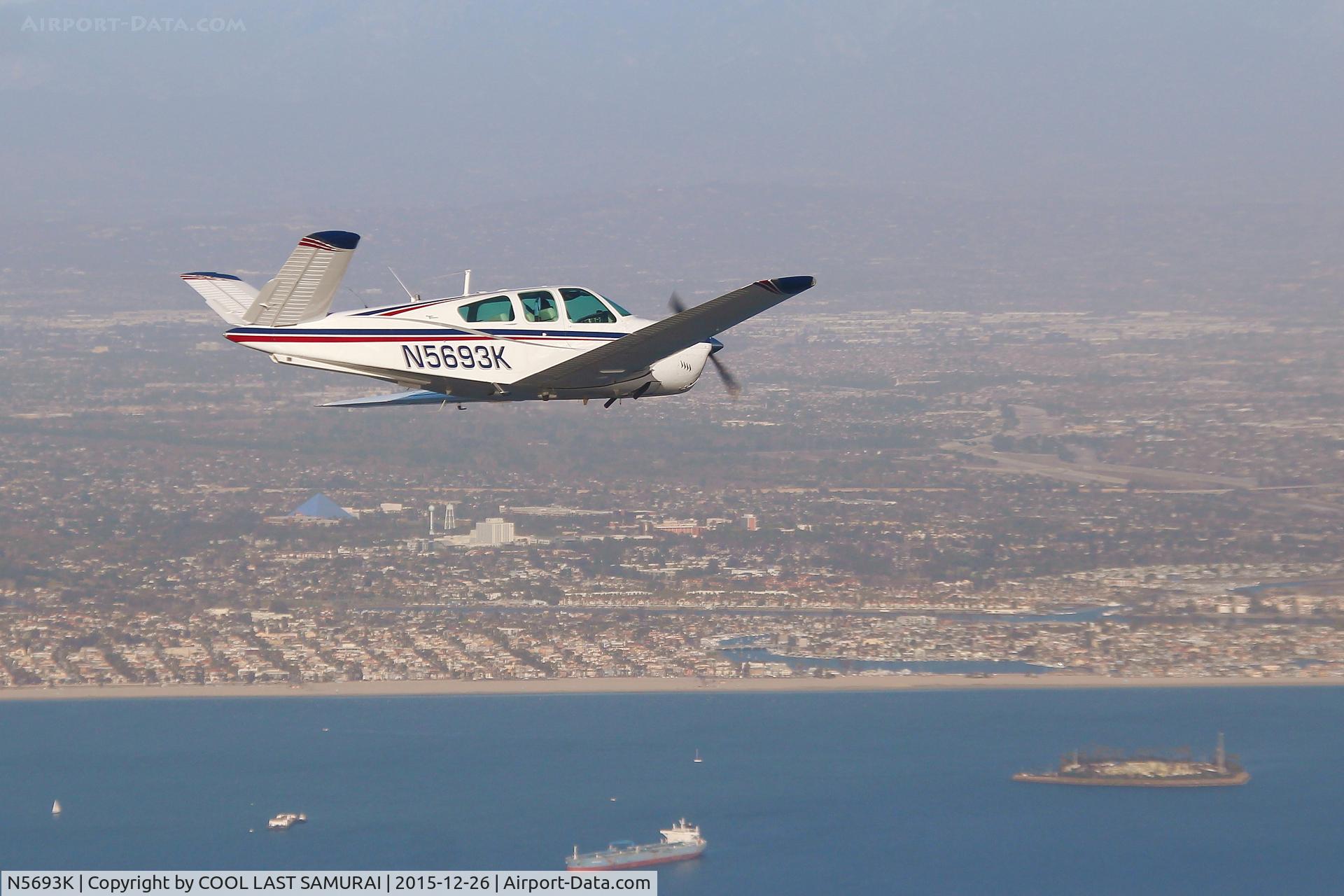 N5693K, 1964 Beech S35 Bonanza C/N D-7625, 93K flying over Long Beach Bay. Photo by MKoba